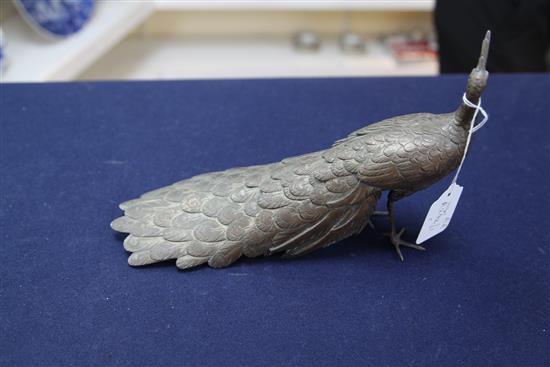 A Japanese silvered copper-bronze figure of a peacock, Meiji period, length 25cm, lacking base